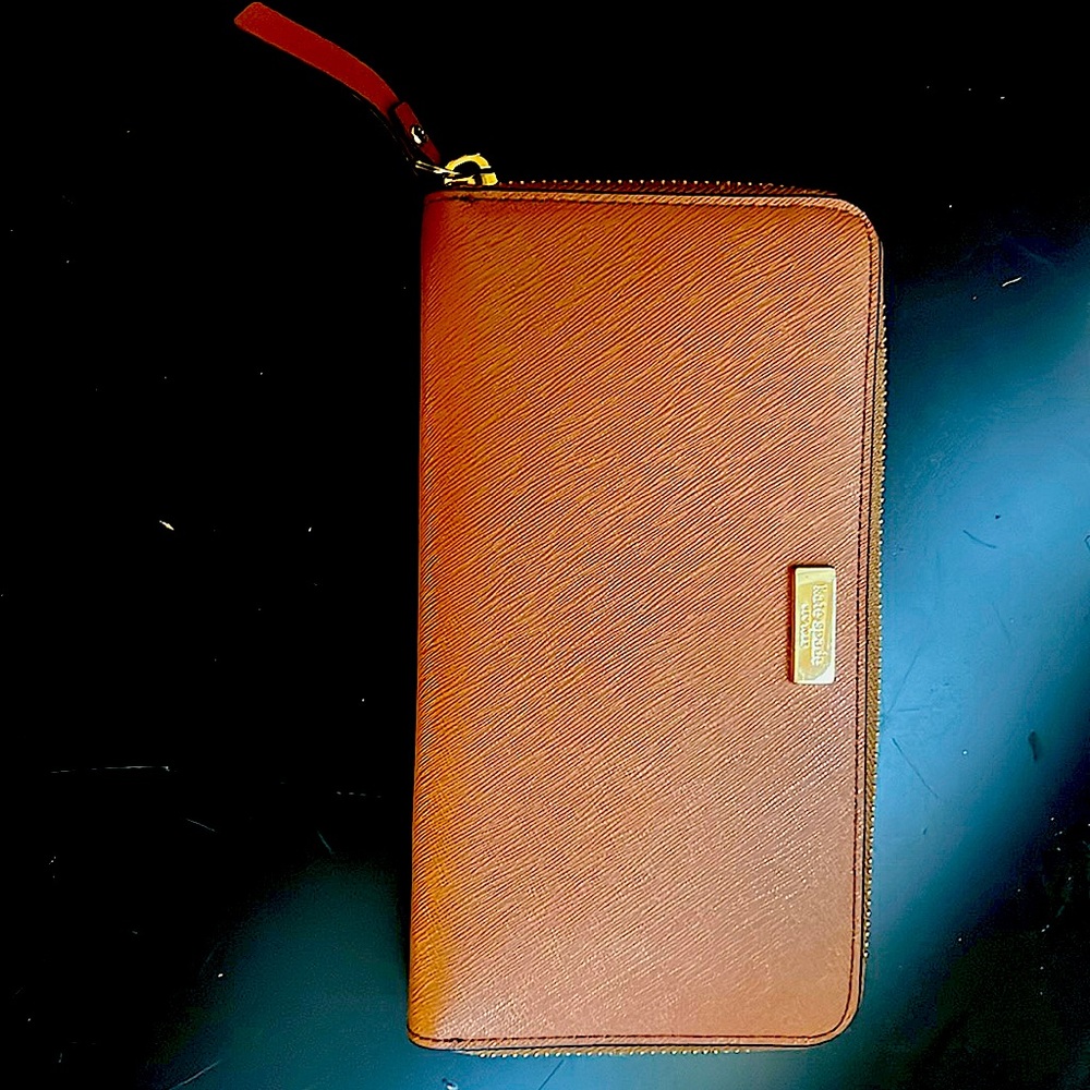Kate Spade wallet used only a couple of times. Beautifully rust color.